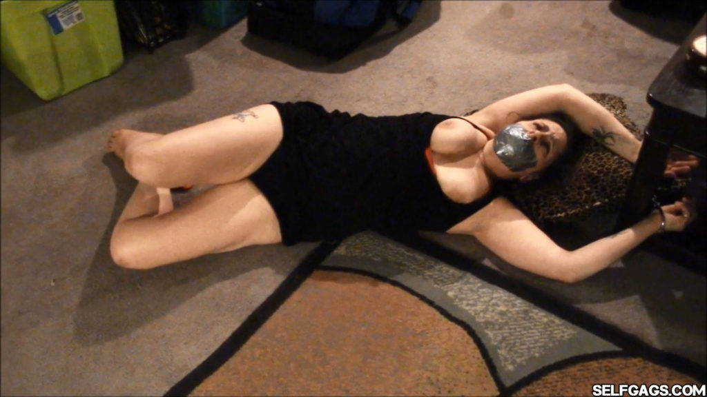 duct tape gagged and handcuffed with her tits exposed
