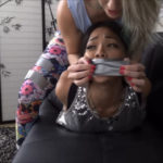 Asian girl tape gagged by a woman