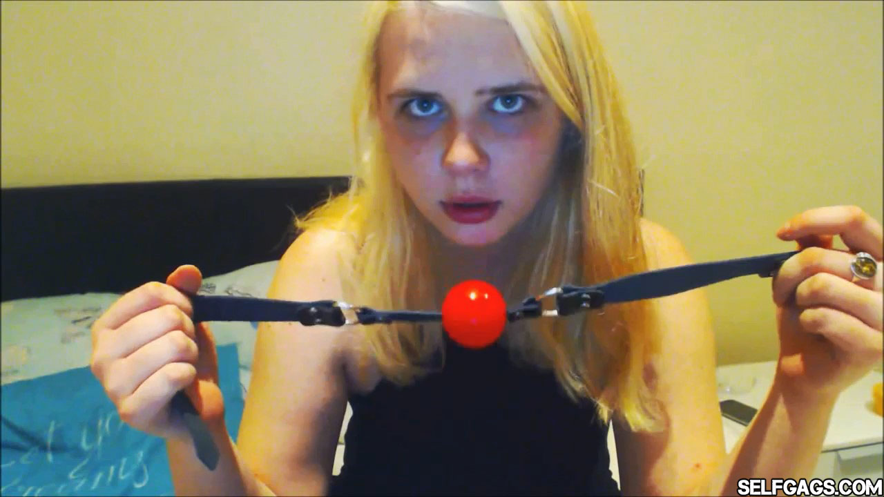 Young blonde girl with red ball gag selfgags