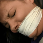 Tightly tape gagged girl crying