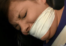 Tightly tape gagged girl crying