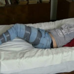 tape gagged girl in tape bondage