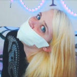 Blonde girl gagged with microfoam tape