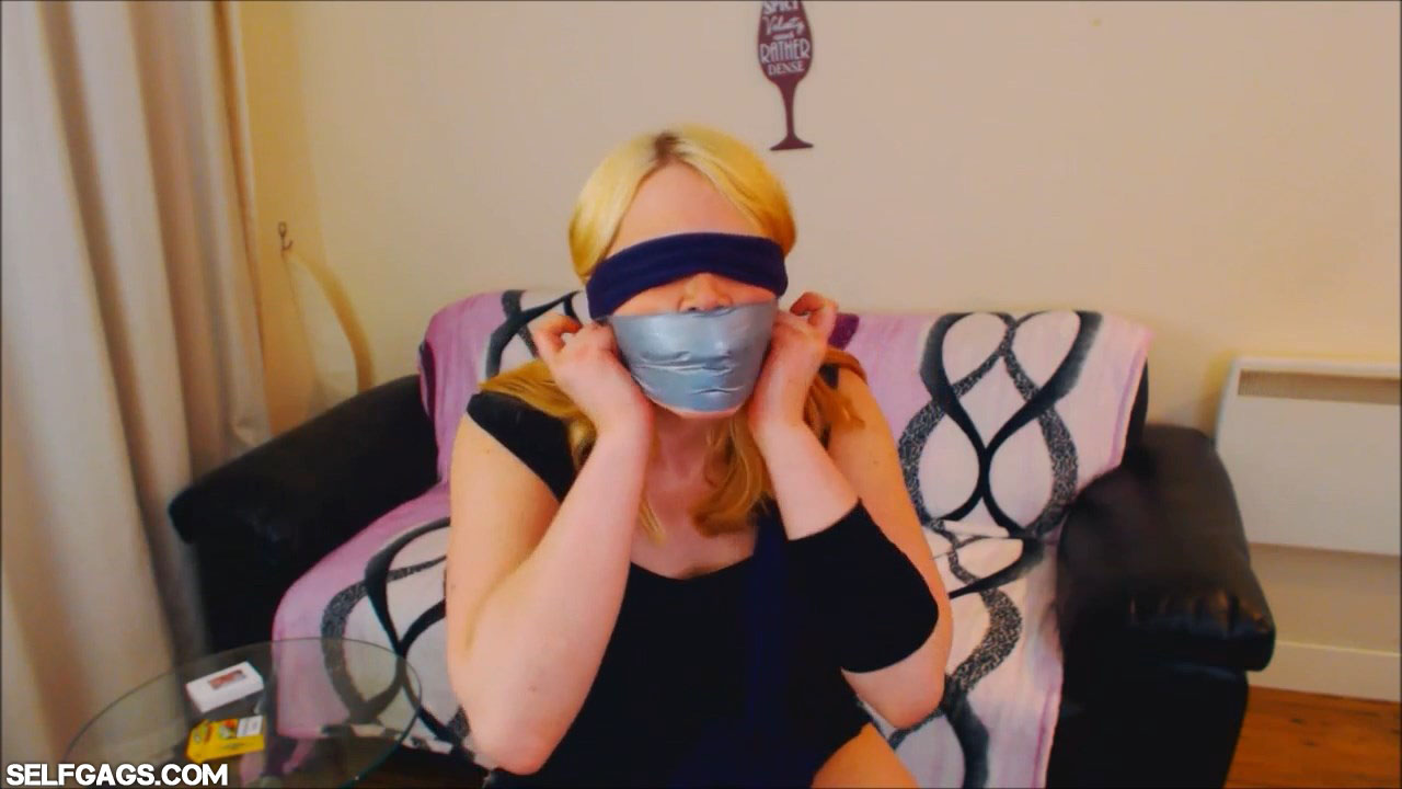 Drunk girl blindfolded and tape gagged