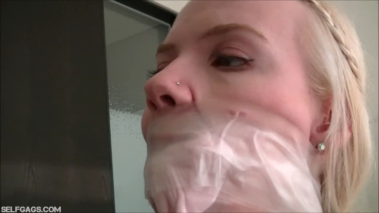 Blonde Vanessa sock gagged and tape gagged tight