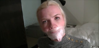 Scandinavian Blonde: All Gagged Up With Inflatable Butterfly, Vet Wrap And A Cruel Double Sock Stuffing Wrapped In Her Mouth With Clear Medical Tape! Blonde Vanessa with socks taped in her mouth under clear tape gag wrapped around her head