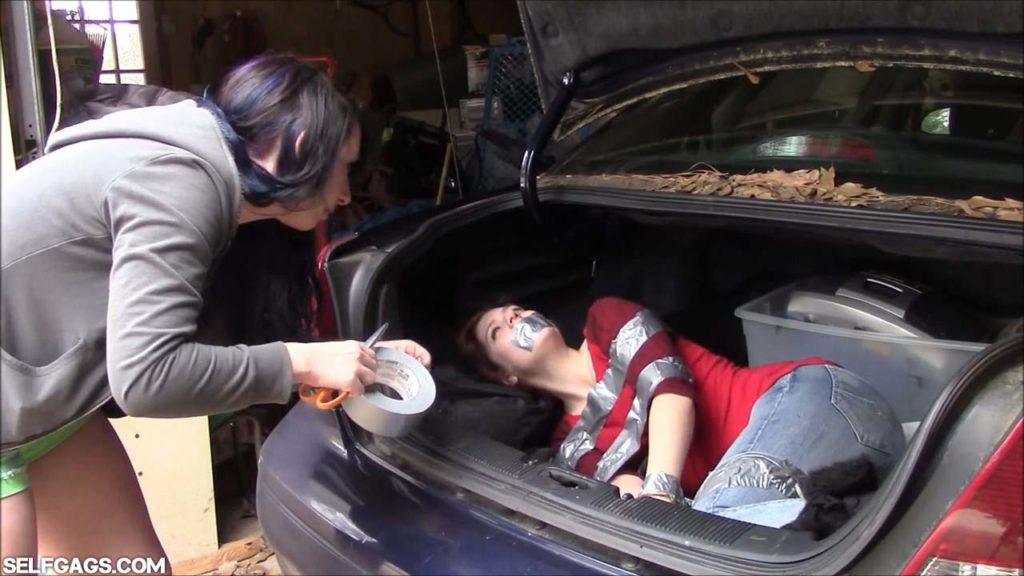 Little sister tied and tape gagged in car trunk
