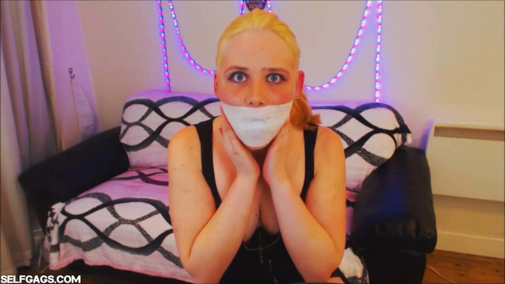 Blonde girl tape gagged