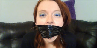 Her Very First Time Gagged! Redhead gagged with black bondage tape around the head