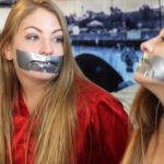 Tape gagged sisters in bondage