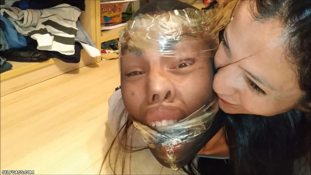 Tied and gagged latina girl head encased with pantyhose in tight bdsm