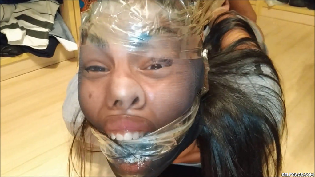 Tied and gagged latina girl head encased with pantyhose in tight bdsm