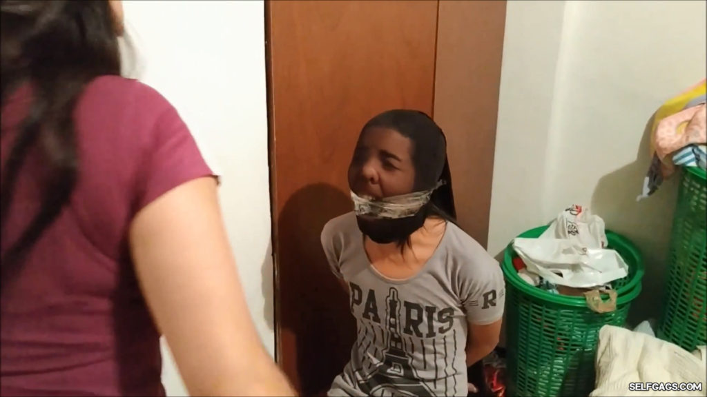 latina girl pantyhose head encased and cleave gagged with tape