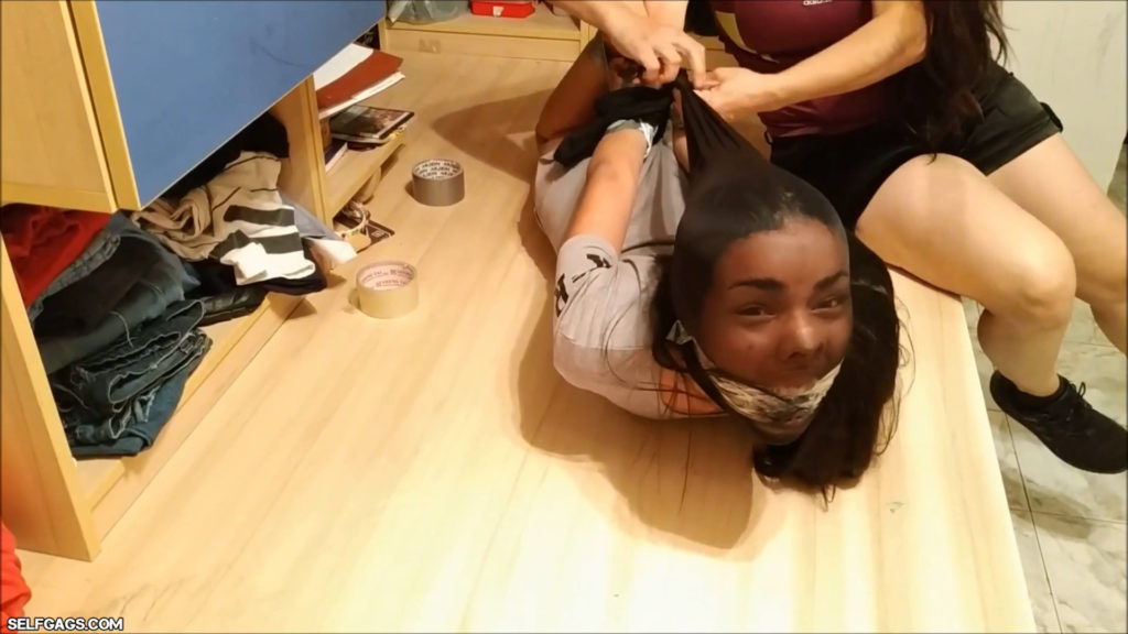 Tied and gagged latina girl head encased with pantyhose in tight bdsm