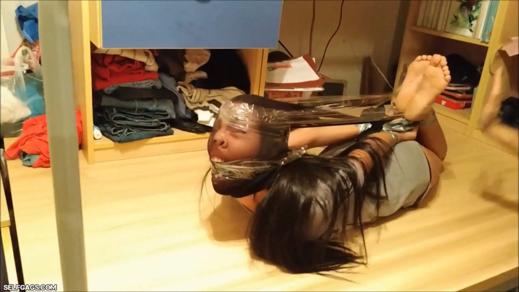 Tied and gagged latina girl head encased with pantyhose in tight bdsm