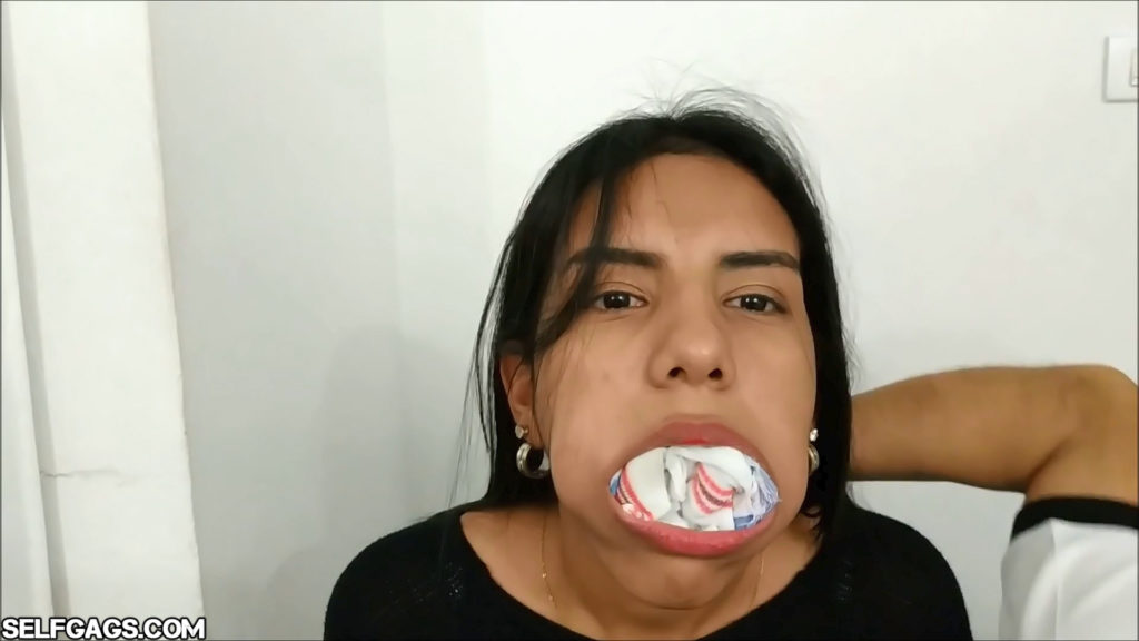 Young latina girl gagged with ten socks taped in her mouth