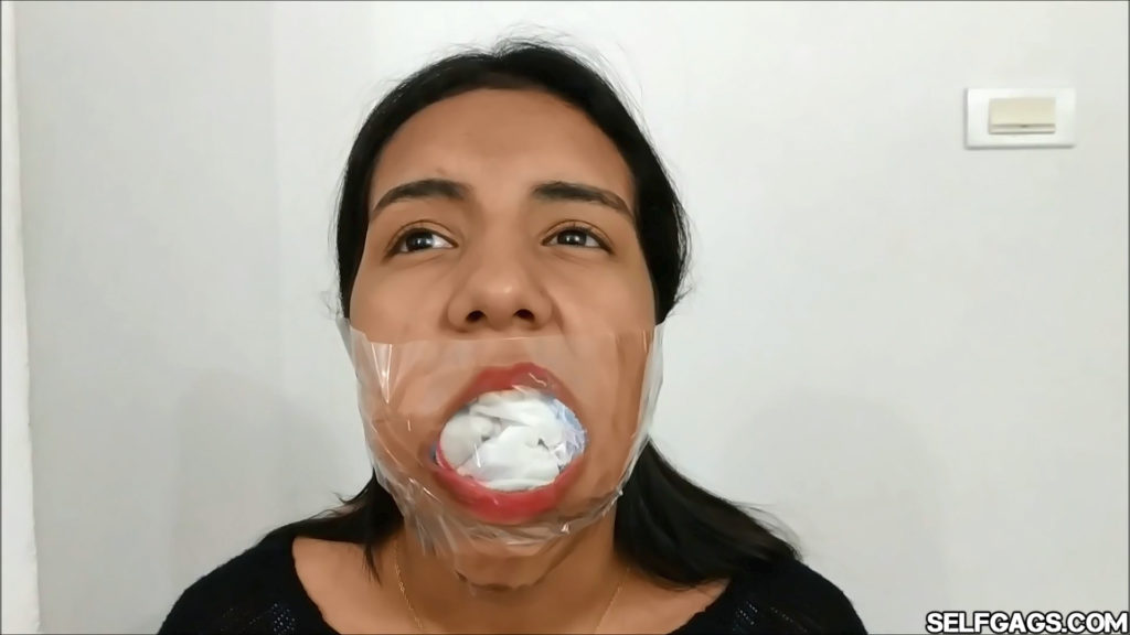 Young latina girl gagged with ten socks taped in her mouth