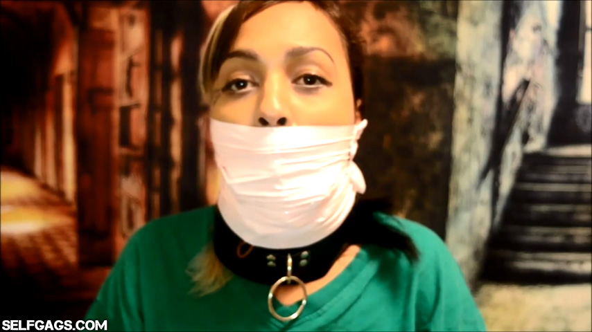 collared girl gagged with tape wrapped over her mouth