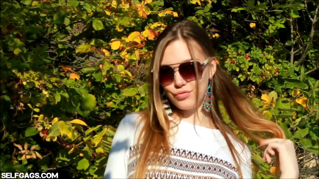 Sexy glamour model wearing sunglasses in the great outdoors