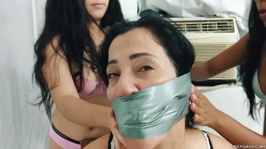 Bound and tape wrap gagged latina milf stuck in duct tape bondage