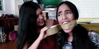 Bound And Gagged For Social Media Likes! Sexy girl with dark hair gets tape wrap gagged by best friend in bondage