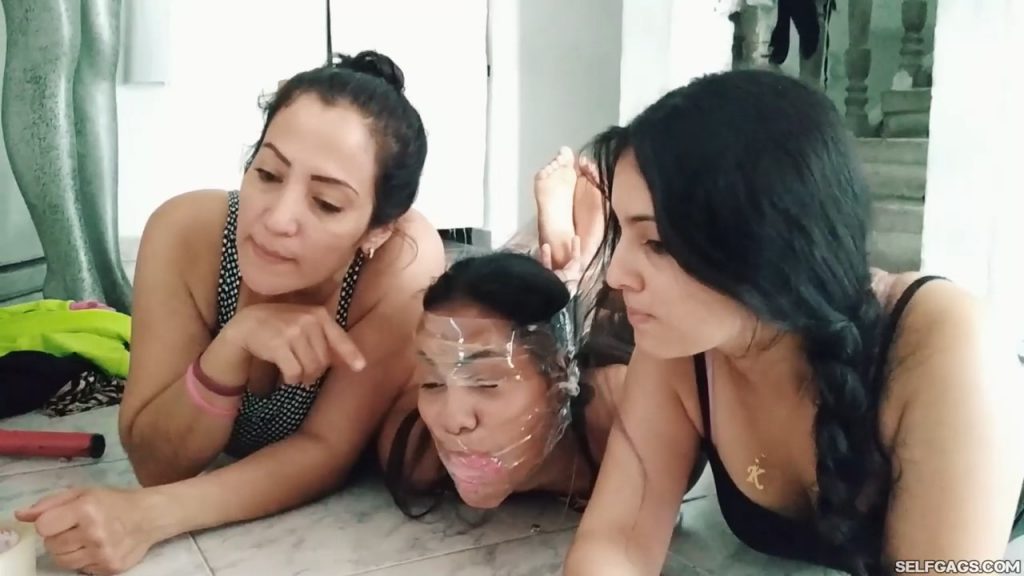 Online latina girl seller tied up and gagged with panties stuffed in her mouth by two women