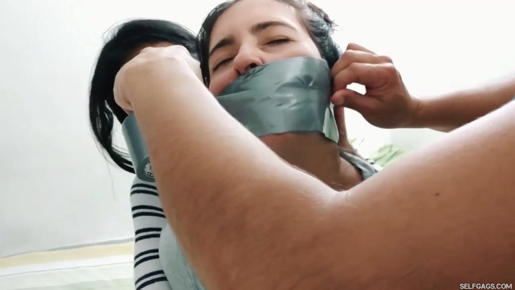 Sexy girl getting tape gagged