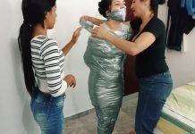 Tape wrap gagged fetish girl trapped in tight silver duct tape mummification bondage