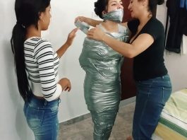 Tape wrap gagged fetish girl trapped in tight silver duct tape mummification bondage