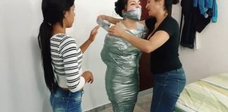 Sexy Girl Ambused For Mummification Bondage When She Least Expected It! Tape wrap gagged fetish girl trapped in tight silver duct tape mummification bondage