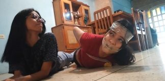 Alexandra’s Tape Bound Bondage Bitch! Gagged girl hogtied by girl with glasses in tight tape bondage