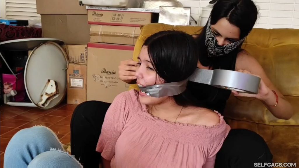 Young girl tape cleave gagged by masked female bandit