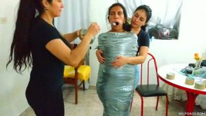 Gagged Latina Girl Wrapped In Sheets And Mummified With Duct Tape Bondage