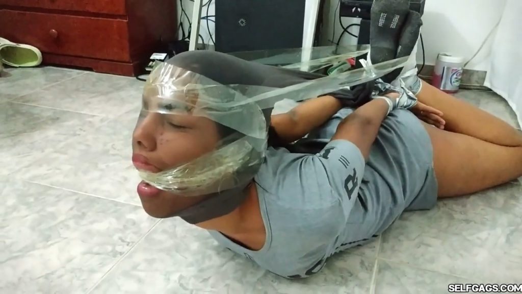 Bound and gagged girls hooded with pantyhose and hogtied for tight bdsm