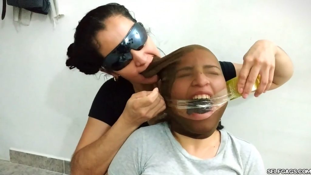 Bound and gagged girls hooded with pantyhose and hogtied for tight bdsm