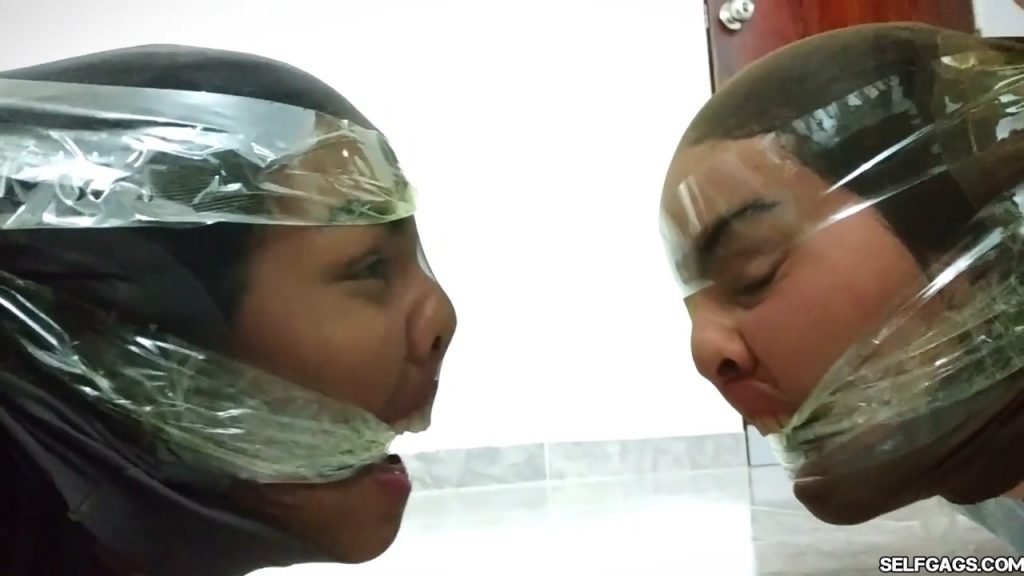 Bound and gagged girls hooded with pantyhose and hogtied for tight bdsm
