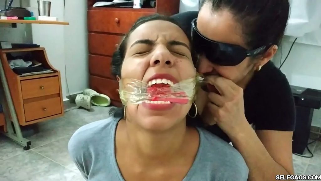 Bound and gagged girls hooded with pantyhose and hogtied for tight bdsm