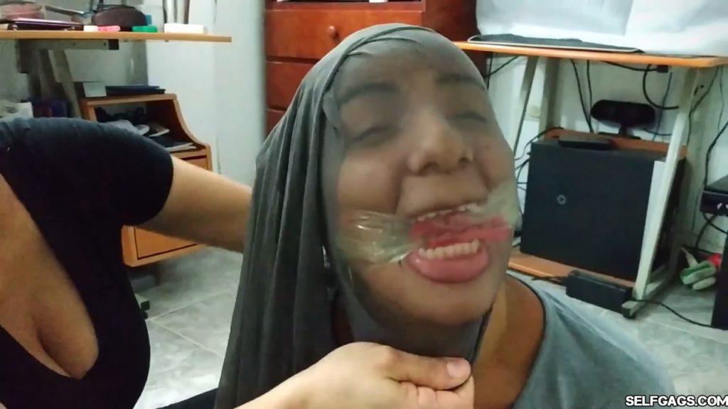 Bound and gagged girls hooded with pantyhose and hogtied for tight bdsm