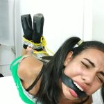 Sexy hogtied teenage bondage girl with pigtails belt gagged on table in high heels