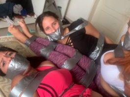 Three gagged girls in tape bondage