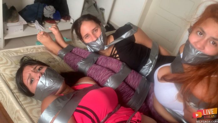 Three gagged girls in tape bondage