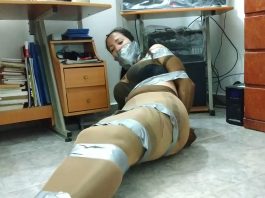 Pantyhose encased babysitter tied up and gagged with duct tape