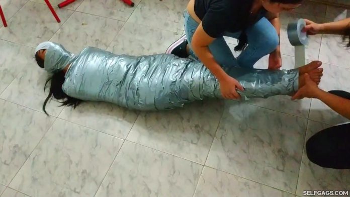 Tape Gagged Girl Mummified And Pantyhooded