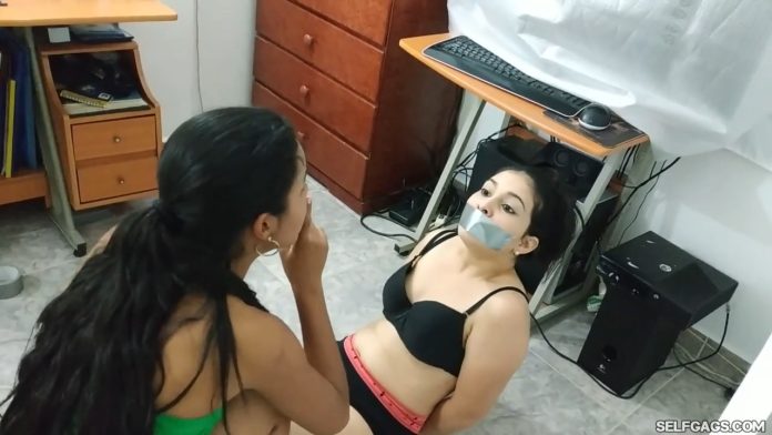 Little sister finds big sister gagged and bound by a robber on the floor
