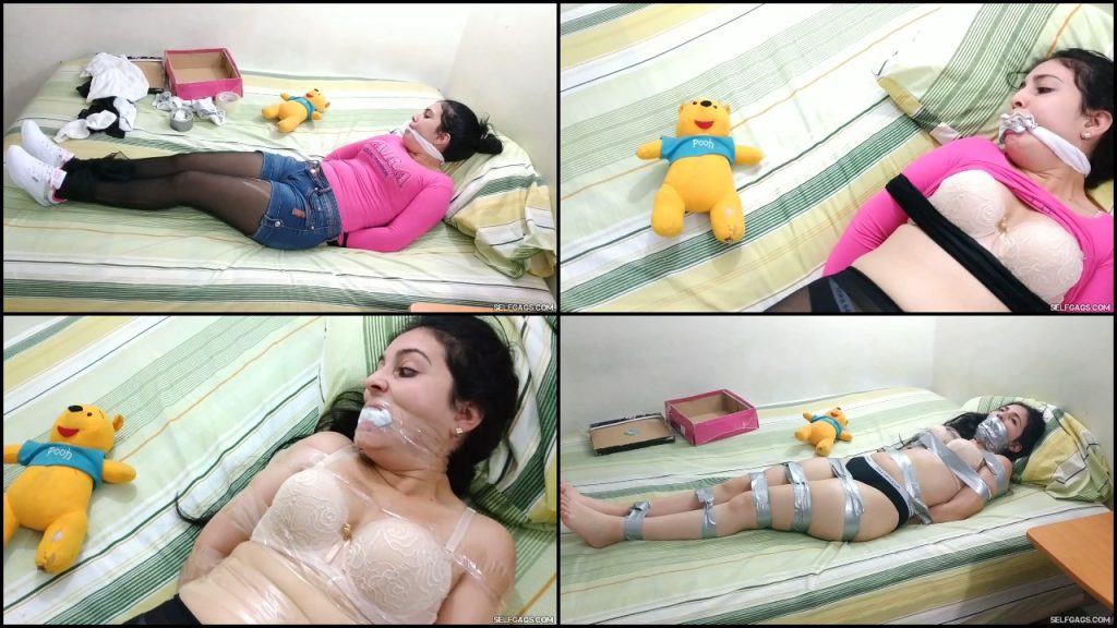 Teenage girl wearing pantyhose tied up and gagged by cursed teddy bear