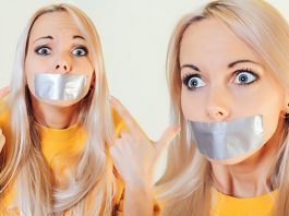 Wide-Eyed Blonde Girl Gagged With Duct Tape