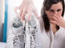 Woman Holding Stinky White Shoes