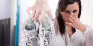 How Sniffing My Female Co-Worker’s Stinky Sneakers Got Me Into Female Domination Woman Holding Stinky White Shoes