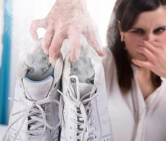 How Sniffing My Female Co-Worker’s Stinky Sneakers Got Me Into Female Domination Woman Holding Stinky White Shoes