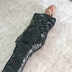 Pantyhose hooded girl ball gagged in tight mummification encasement bondage